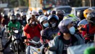 Motorists queue at a checkpoint on the first day of a two-week lockdown to prevent the spread of the highly infectious coronavirus Delta variant, in Quezon City, Metro Manila, Philippines, August 6, 2021. REUTERS/Eloisa Lopez