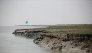 FILE PHOTO: View of the island of Bhasan Char in the Bay of Bengal, Bangladesh February 14, 2018. Picture taken February 14, 2018. REUTERS
