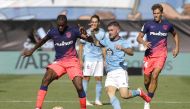 Soccer Football - LaLiga - Celta Vigo v Atletico Madrid - Estadio de Balaidos, Vigo, Spain - August 15, 2021 Atletico Madrid's Geoffrey Kondogbia in action with Celta Vigo's Javi Galan REUTERS/Miguel Vidal

