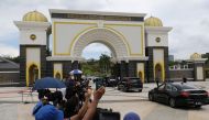 A convoy with Malaysian Prime Minister Muhyiddin Yassin arrives at the National Palace for his meeting with the king, in Kuala Lumpur, Malaysia August 16, 2021. Reuters/Lim Huey Teng