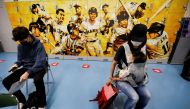 People wait for consultation after receiving the coronavirus disease (COVID-19) vaccine at the Tokyo Dome, the home ground of the Japanese professional baseball team Yomiuri Giants which is being used as a large-scale COVID-19 vaccination center, in Tokyo