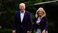 U.S. President Joe Biden and first lady Jill Biden walk from Marine One as they return from Camp David, on the South Lawn at the White House in Washington, U.S., July 18, 2021. REUTERS/Elizabeth Frantz

