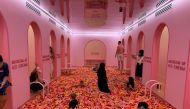 Visitors play in a 'sprinkle pool' at the Museum of Ice Cream in Singapore, August 19, 2021. REUTERS/Travis Teo
