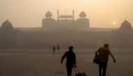 People arrive to visit the Red Fort on a smoggy morning in the old quarters of Delhi, India, November 10, 2020. REUTERS/Danish Siddiqui/File Photo