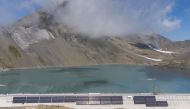 Solar panels are seen on the construction site of a large-scale photovoltaic system of Swiss energy provider Axpo at some 2500 metres above sea level on the dam of Lake Muttsee, Switzerland August 19, 2021. Picture taken with a drone, August 19, 2021. REU