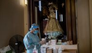 A health worker prepares Remdesivir for a coronavirus disease (COVID-19) patient admitted in the chapel of Quezon City General Hospital turned into a COVID-19 ward amid rising infections, in Quezon City, Metro Manila, Philippines, August 20, 2021. REUTERS