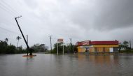 A road next to a convenience store is flooded after Hurricane Grace slammed into the coast with torrential rains, in Costa Esmeralda, near Tecolutla, Mexico August 21, 2021. REUTERS/Yahir Ceballos
