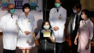 Taiwan President Tsai Ing-wen poses with her vaccination record after receiving a dose of Medigen Vaccine Biologics Corp's coronavirus disease (COVID-19) vaccine, a domestically developed vaccine against the disease, at National Taiwan University Hospital