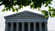 FILE PHOTO: The sun rises behind the U.S. Supreme Court in Washington, U.S., June 1, 2021. REUTERS/Erin Scott/File Photo/File Photo
