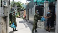 Vietnam soldiers deliver boxes with food into strict lockdown areas amid the coronavirus disease (COVID-19) pandemic in Ho Chi Minh, Vietnam, August 24, 2021. REUTERS/Stringer