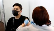 A man receives the Moderna coronavirus vaccine at the Tokyo Metropolitan Government building in Tokyo, Japan June 25, 2021. Rodrigo Reyes Marin/Pool via REUTERS/File Photo