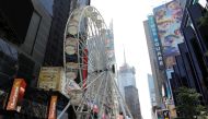 A view shows the Times Square Wheel, a Ferris wheel constructed in Times Square, ahead of its opening in Manhattan, New York City, U.S., August 25, 2021. REUTERS/Andrew Kelly