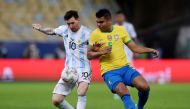 July 10, 2021 Brazil's Real Madrid midfielder Casemiro in action with Argentina's Lionel Messi REUTERS/Amanda Perobelli/File Photo