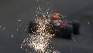 Sparks are seen from the car of Red Bull's Max Verstappen during practice REUTERS/Christian Hartmann