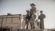 U.S. service members assist at an Evacuation Control Check Point (ECC) during an evacuation at Hamid Karzai International Airport, Kabul, Afghanistan, August 26, 2021. 