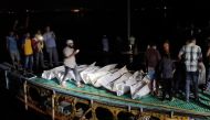 Recovered bodies are seen after a boat packed with passengers slammed into a vessel transporting sand, in Brahmanbaria, Bangladesh August 27, 2021. REUTERS/Stringer