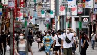 People walk in Shibuya shopping area, during a state of emergency amid the coronavirus disease (COVID-19) outbreak in Tokyo, Japan August 29, 2021. REUTERS/Androniki?Christodoulou