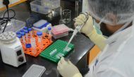 A research scientist works inside a laboratory of India's Serum Institute, the world's largest maker of vaccines, which is working on vaccines against the coronavirus disease (COVID-19) in Pune, India, May 18, 2020. REUTERS/Euan Rocha/File Photo