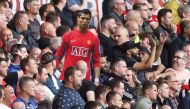 General view of Manchester United fans holding up a cardboard cut out of Cristiano Ronaldo Action Images via Reuters/Carl Recine 