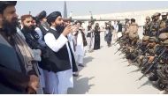 Taliban spokesman Zabihullah Mujahid speaks to Badri 313 military unit at Kabul's airport, Afghanistan August 31, 2021 in this still image obtained from a handout video. Taliban/Handout via Reuters 