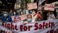 Healthcare workers hold a protest outside the Philippines' health department, demanding better wages and benefits amid rising coronavirus disease (COVID-19) infections, in Manila, Philippines, September 1, 2021. REUTERS/Eloisa Lopez
