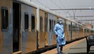 A health worker takes a break, as South Africa's rail company Transnet turned a train (not in the picture) into a coronavirus disease (COVID-19) vaccination center on rails to help the government speed up its vaccine rollout in the country's remote commun