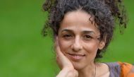 FILE PHOTO: Masih Alinejad, 37, Iranian journalist, poses for a portrait in London October 8, 2013. REUTERS/Toby Melville/File Photo