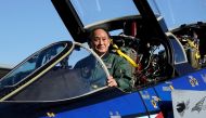 Japanese Prime Minister Yoshihide Suga sits in the cockpit of a F4EJ Kai jet fighter of Japan's Air Self-Defense Force at Iruma Air Base in Sayama, Saitama Prefecture, Japan, November 28, 2020. Kimimasa Mayama/Pool via REUTERS/File Photo
