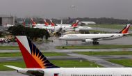 FILE PHOTO: Philippine Airlines (PAL) planes are seen parked on the tarmac in Manila International Airport in Pasay city, metro Manila September 9, 2014. REUTERS/Romeo Ranoco