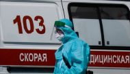 A medical specialist walks by an ambulance outside a hospital for patients infected with the coronavirus disease (COVID-19) in Moscow, Russia June 16, 2021. REUTERS/Maxim Shemetov/File Photo
