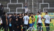 Soccer Football - World Cup - South American Qualifiers - Brazil v Argentina - Arena Corinthians, Sao Paulo, Brazil - September 5, 2021 Players and officials are seen on the pitch as play is interrupted after Brazilian health officials objected to the par