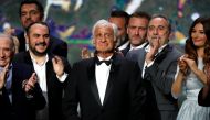 FILE PHOTO: Actor Jean-Paul Belmondo reacts on stage as he receives an Honorary Cesar Award at the 42nd Cesar Awards ceremony in Paris, France, February 24, 2017. REUTERS/Philippe Wojazer/File Photo
