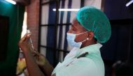 A nurse prepares a dose of the Sinopharm coronavirus disease (COVID-19) vaccine at Wilkins Hospital in Harare, Zimbabwe, March 24, 2021. REUTERS/Philimon Bulawayo/File Photo
