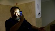 Chinese artist Ai Weiwei poses for a portrait during a presentation of his new exhibition 