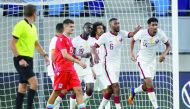 Qatar's Homam Ahmed (right) celebrates with team-mates after scoring a goal against Luxembourg in their European Qualifying match played at Stade de Luxembourg, yesterday.