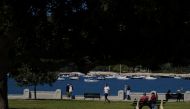 People enjoy a sunny day next to Balmoral Beach during a lockdown to curb the spread of a coronavirus disease (COVID-19) outbreak in Sydney, Australia, September 8, 2021. REUTERS/Loren Elliott