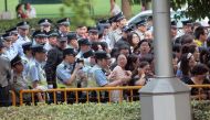 Police officers remove fans standing outside the opening ceremony of the 17th Shanghai International Film Festival, June 14, 2014. REUTERS/Aly Song (CHINA - Tags: ENTERTAINMENT)