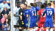 Soccer Football - Premier League - Liverpool v Chelsea - Anfield, Liverpool, Britain - August 28, 2021 Chelsea's Cesar Azpilicueta and teammates argue with the referee after he gave Liverpool a penalty and Reece James a red card REUTERS/Peter Powell
