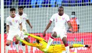 Qatar's Abdelkarim Hassan tries to block the ball during the match against Luxembourg, on Tuesday.