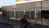 A man cycles past a restaurant closed during the coronavirus disease (COVID-19) outbreak as the country faces tougher lockdown restrictions in Soweto, South Africa, June 28, 2021. REUTERS/Siphiwe Sibeko
