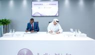 QFC Chief Executive Officer, Yousuf Mohamed Al Jaida, and RFL Chief Executive Officer, Nick Barigye, signing the agreement.