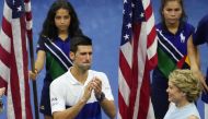 Novak Djokovic of Serbia (L) is overcome with emotion during an interview at USTA Billie Jean King National Tennis Center. Robert Deutsch-USA TODAY Sports
