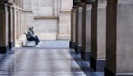 A lone man wearing a protective face mask sits at an unusually quiet State Library on the first day of a lockdown as the state of Victoria looks to curb the spread of a coronavirus disease (COVID-19) outbreak in Melbourne, Australia, July 16, 2021. REUTER
