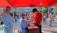 Residents register to take nucleic acid tests at a testing site in Quanzhou, following new cases of the coronavirus disease (COVID-19), in Fujian province, China September 13, 2021. China Daily via REUTERS 