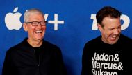 Apple CEO Tim Cook and cast member Jason Sudeikis share a laugh at the premiere for season two of the television series 
