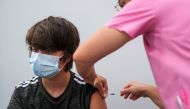 A boy receives his second dose of the Pfizer coronavirus disease (COVID-19) vaccine at a vaccination centre in Seixal, Portugal, September 11, 2021. Picture taken September 11, 2021. REUTERS/Pedro Nunes
