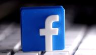 FILE PHOTO: A 3D-printed Facebook logo is seen placed on a keyboard in this illustration taken March 25, 2020. REUTERS/Dado Ruvic/Illustration