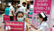 People receive the Sinovac COVID-19 vaccine as the Thai resort island of Phuket rushes to vaccinate its population amid the coronavirus disease (COVID-19) outbreak, and ahead of a July 1 ending of strict quarantine for overseas visitors, to bring back tou