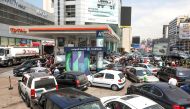 FILE PHOTO: People wait in cars to get fuel at a gas station in Zalka, Lebanon, August 20, 2021. Picture taken August 20, 2021. REUTERS/Mohamed Azakir