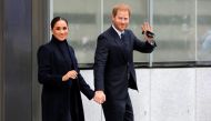 Britain's Prince Harry and Meghan, Duke and Duchess of Sussex, wave while visiting the 9/11 Memorial in Manhattan, New York City, U.S., September 23, 2021. REUTERS/Andrew Kelly